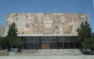 "Knowledge is light" - mosaic on the front side of the gymnasium displaying the national collage of symbols that represent each area of study.